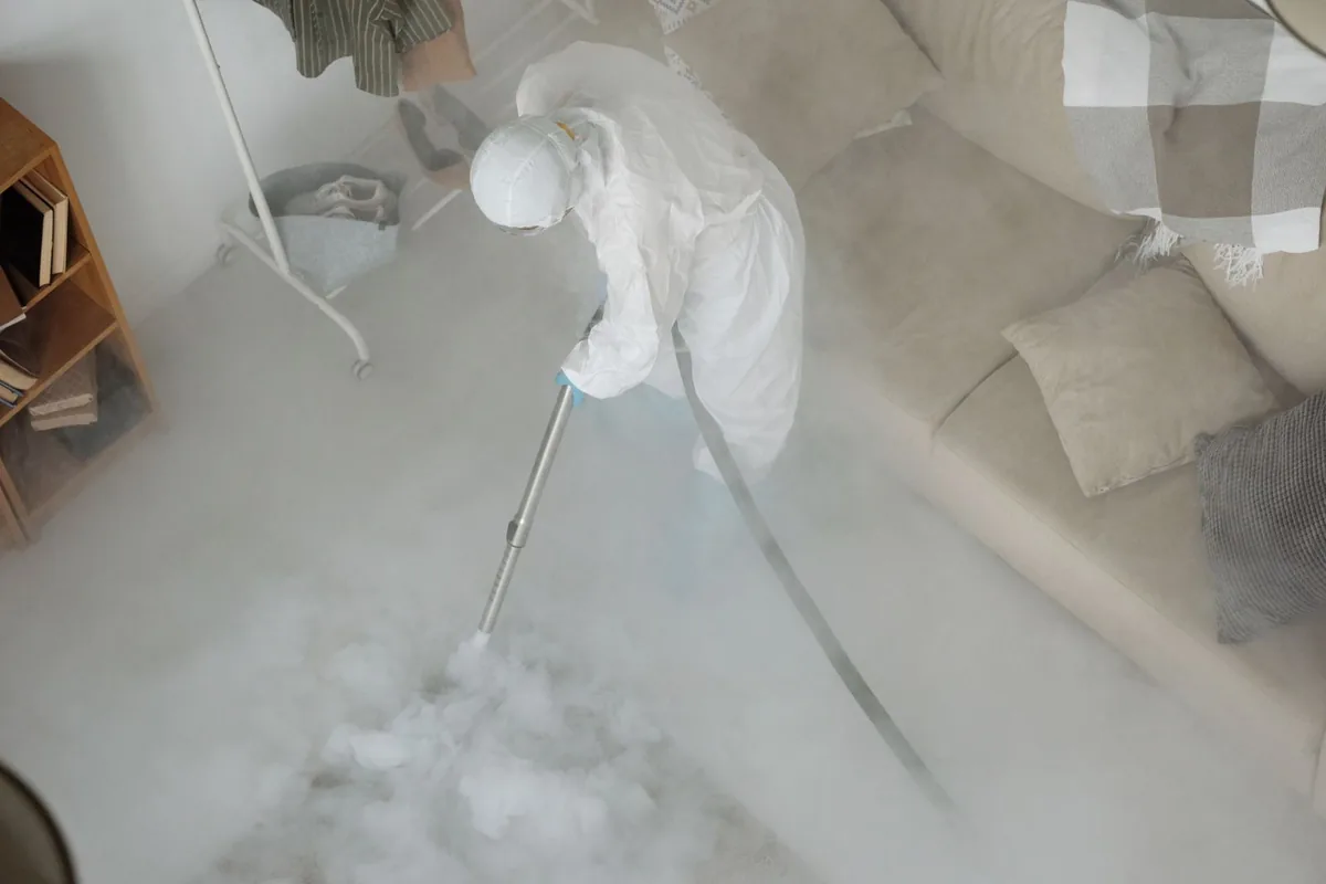 Biohazard cleanup technician in protective equipment, Ferron, UT